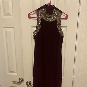 Burgundy evening dress for formal occasion.